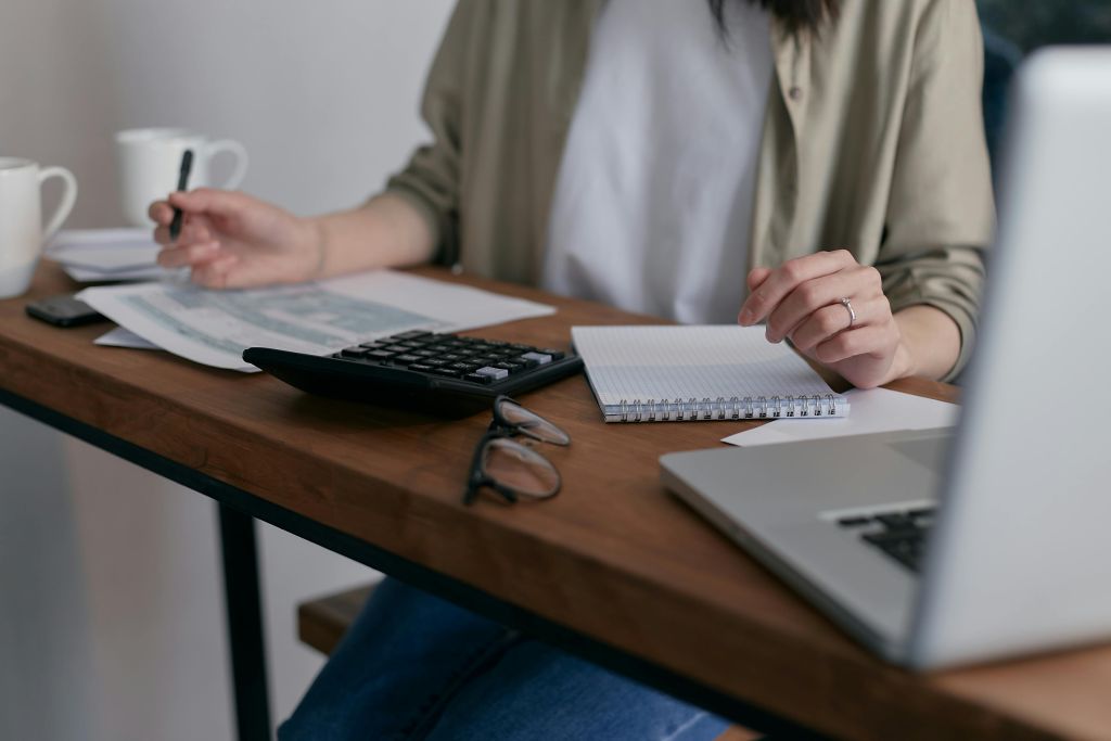 lady working out business tax payments