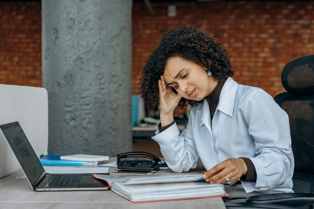 business owner working out her taxes